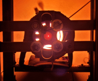 Thruster glows during test in a vacuum chamber